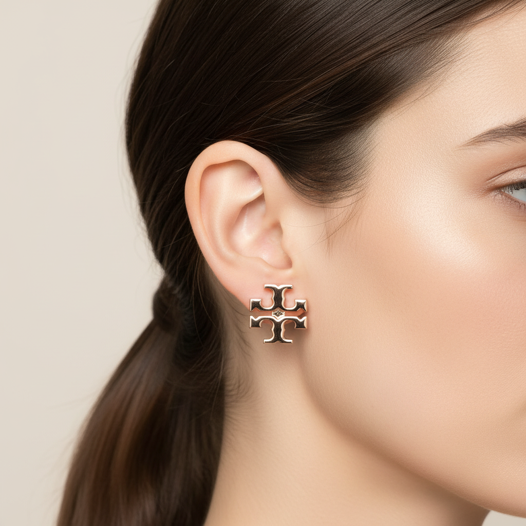 Tory Burch Icon Monogram Stud Earrings in Rose Gold ear close-up