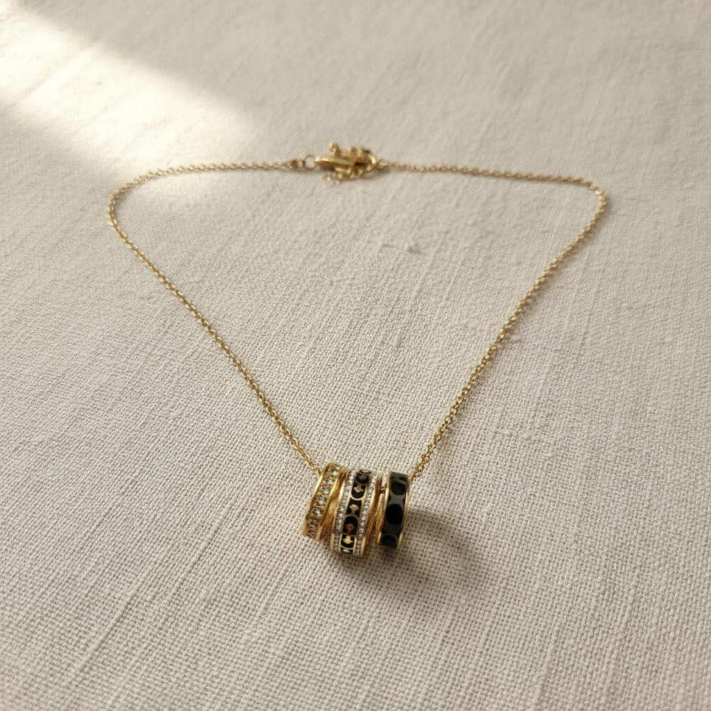 Coach Signature Rondell Necklace on cream linen