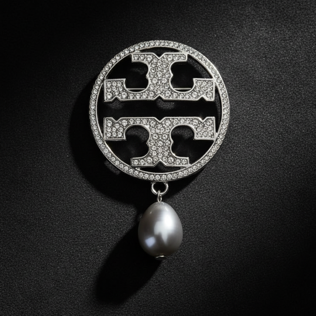 Tory Burch Miller Silver Pave Brooch moody close-up on charcoal velvet