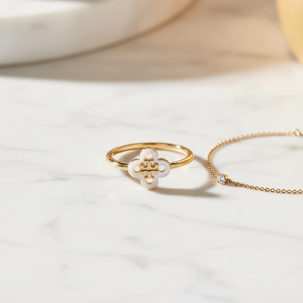 Tory Burch Kira Clover Ring styled flat lay