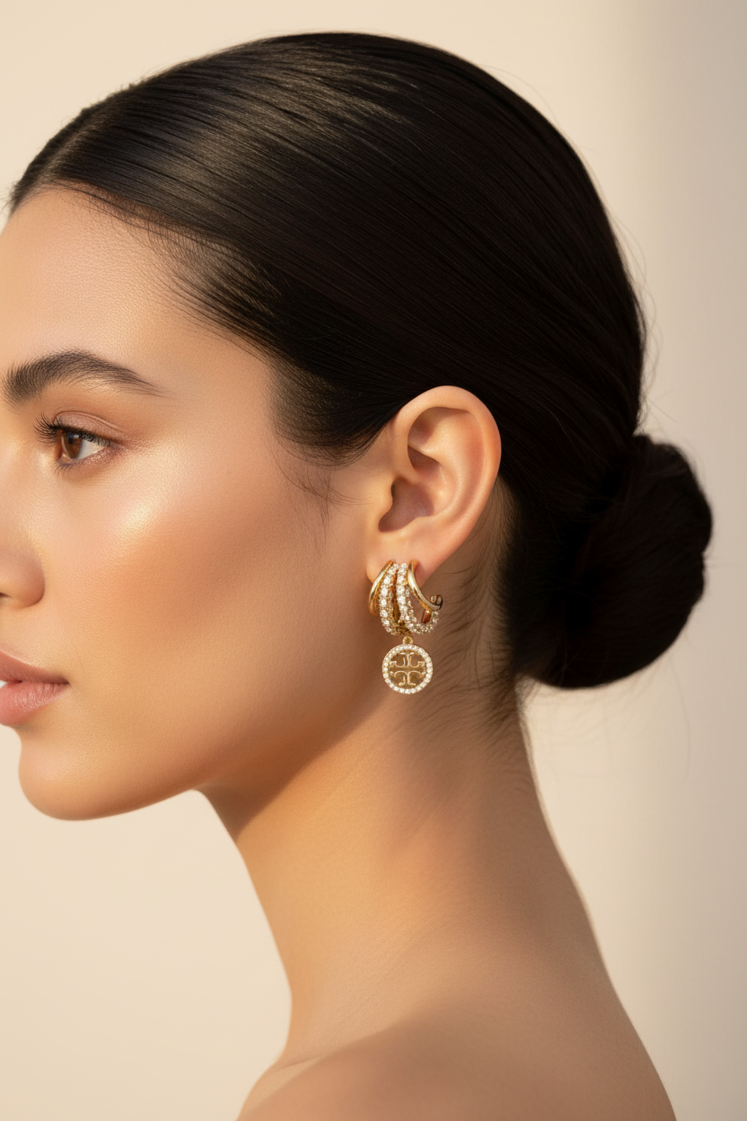 Tory Burch Miller Icon Pavé Triple Hoop Earrings worn on ear
