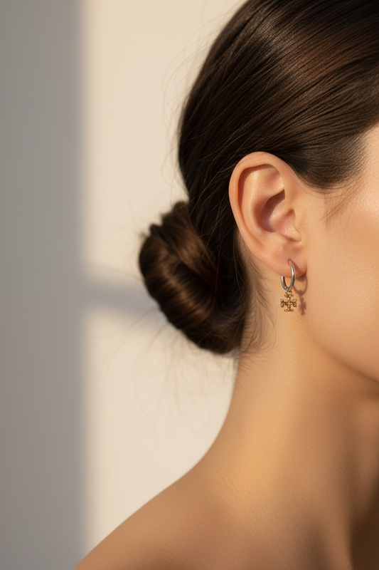 Tory Burch Eleanor Two-Tone Hoop Earrings worn on ear