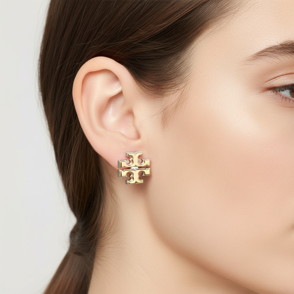 Tory Burch Two-Tone Logo Stud Earrings ear close-up