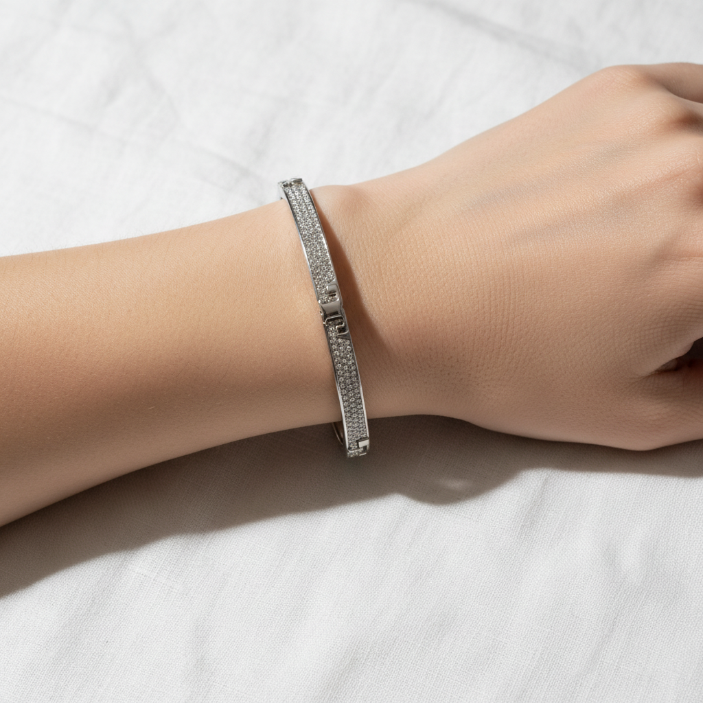 Tory Burch Serif-T Pavé Hinged Bracelet worn on wrist