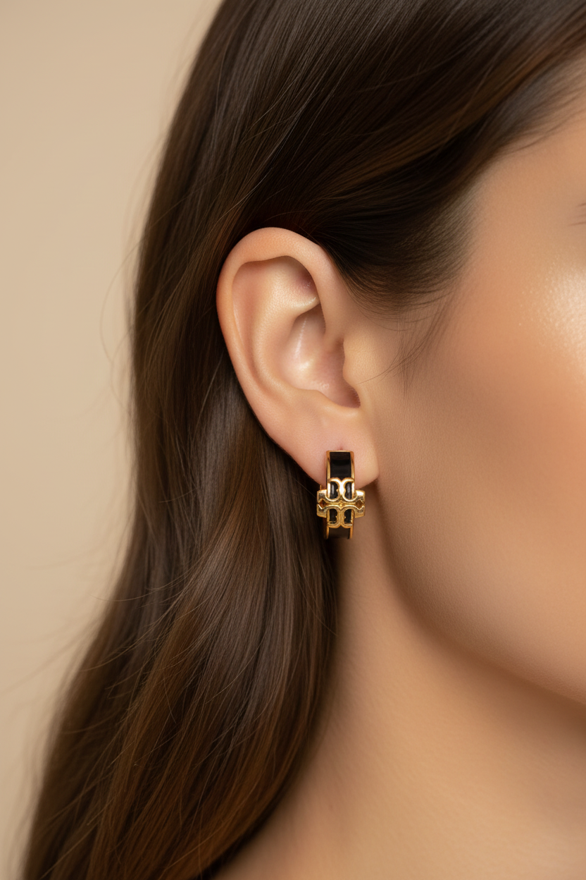 Tory Burch Icon Enamel Hoop Earrings in Black/Gold - worn on model's ear