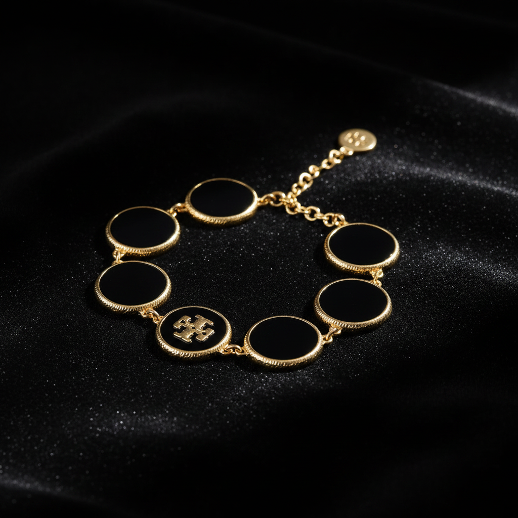 Tory Burch Black Enamel Circle Bracelet moody close-up detail shot