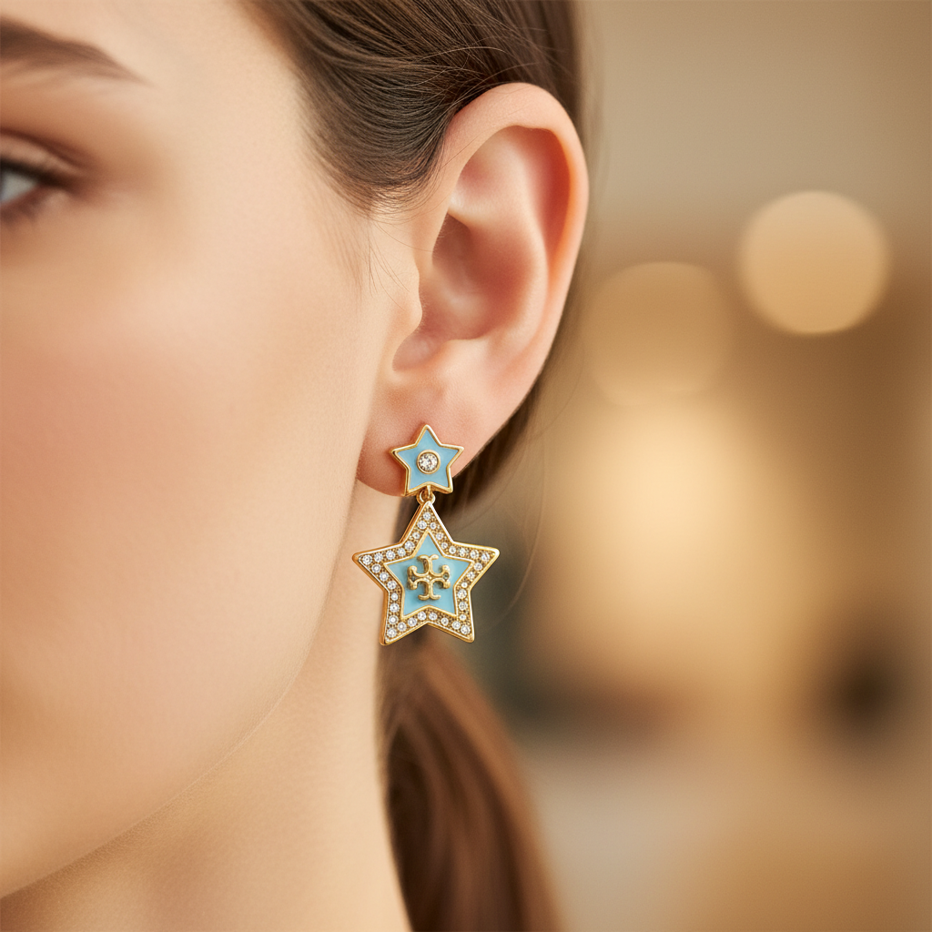 Tory Burch Kira Falling Star Drop Earrings on-ear close-up