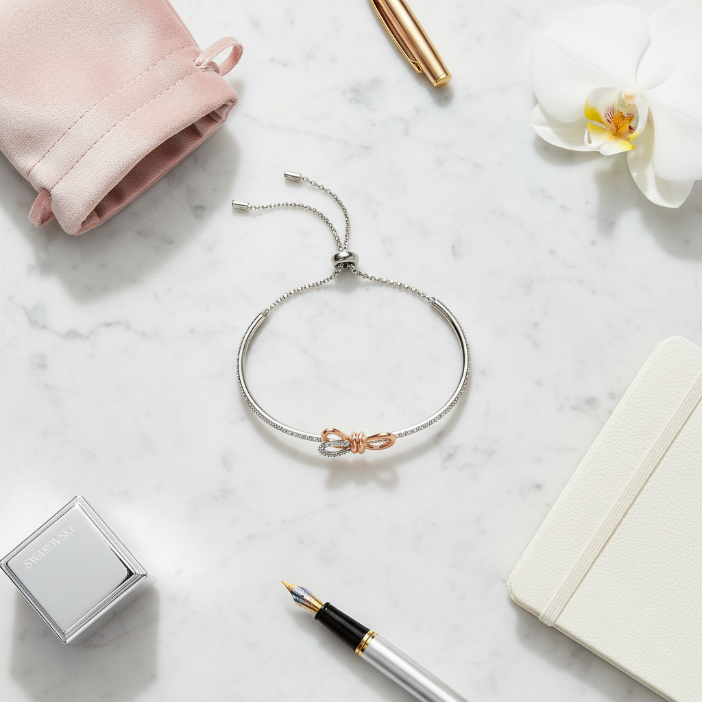 Swarovski Lifelong Bow Bangle - marble flat lay