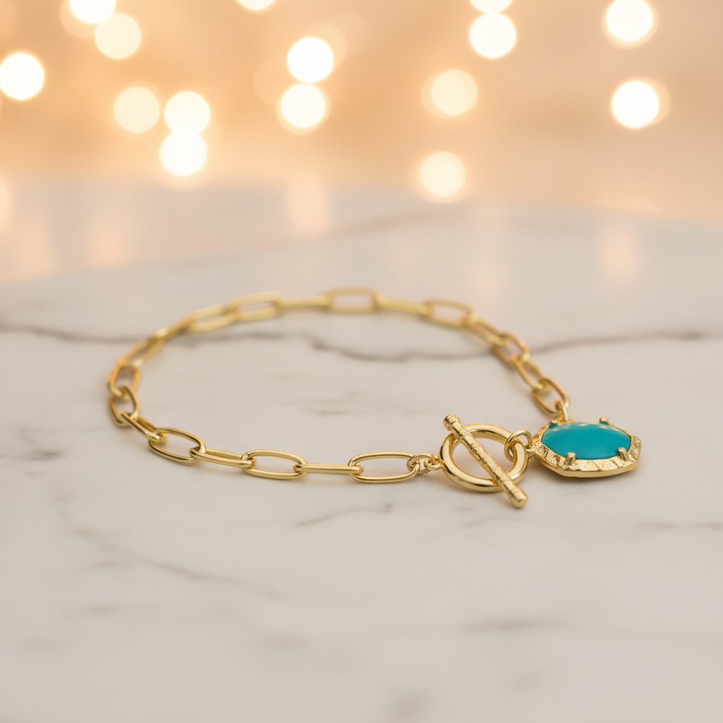 Kendra Scott Daphne Gold Link Turquoise Bracelet on marble surface lifestyle shot