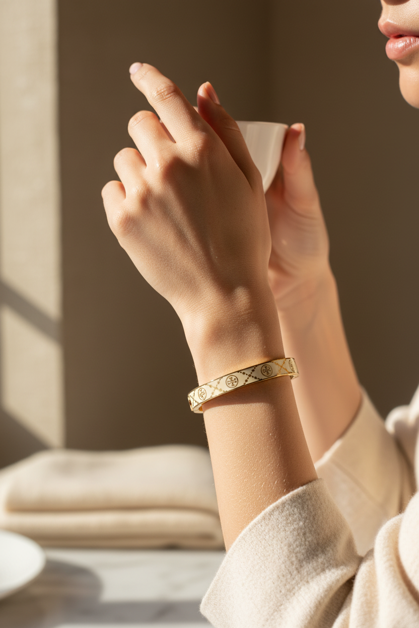 Tory Burch Icon T Monogram Hinge Bracelet worn on wrist