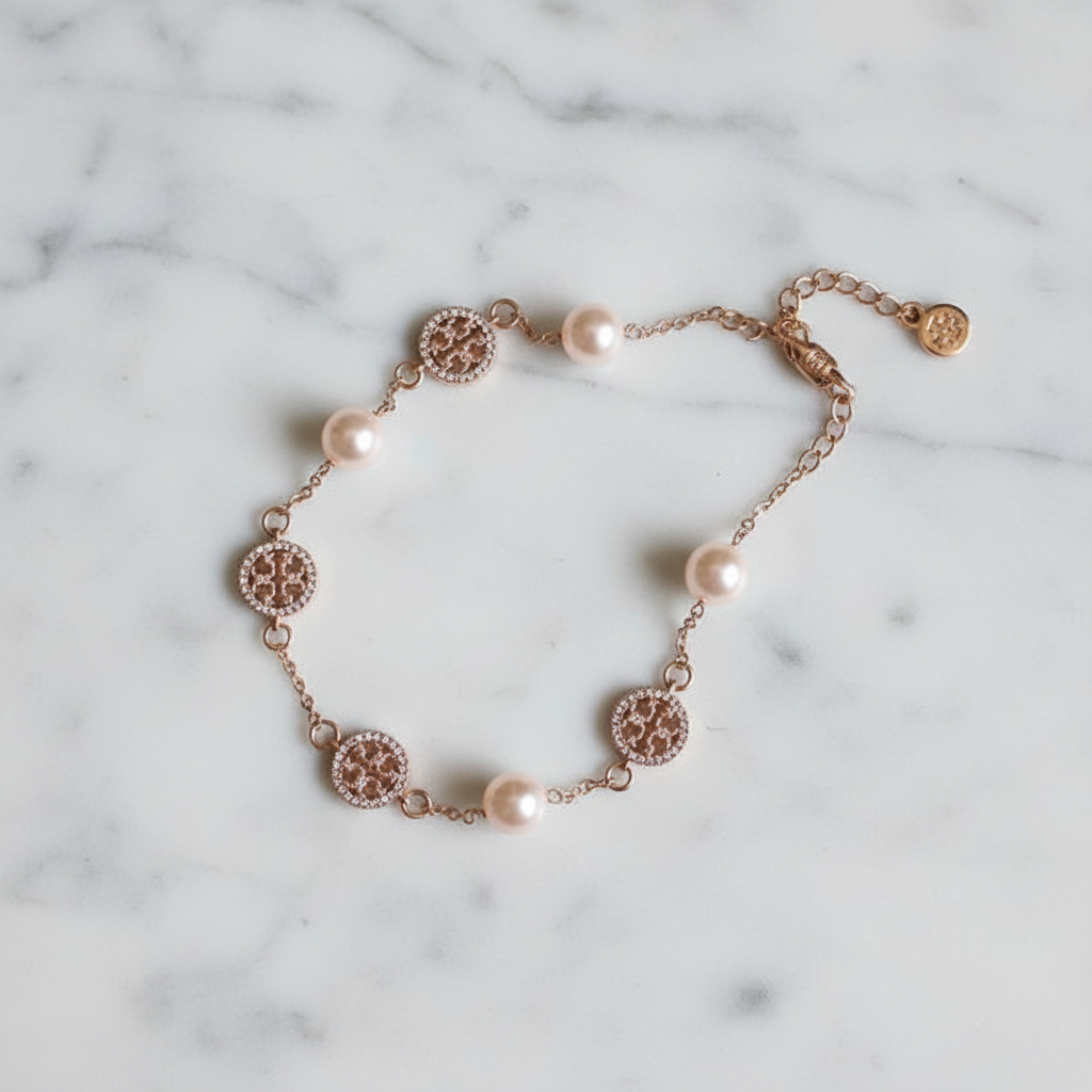Tory Burch Icon Chain Bracelet on marble