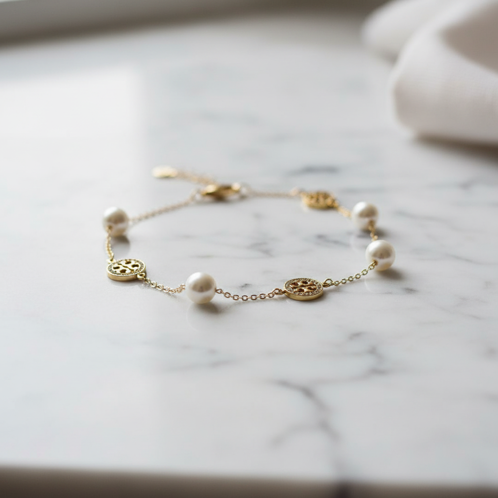 Tory Burch Miller Pavé Crystal Logo and Pearl Bracelet - marble lifestyle shot