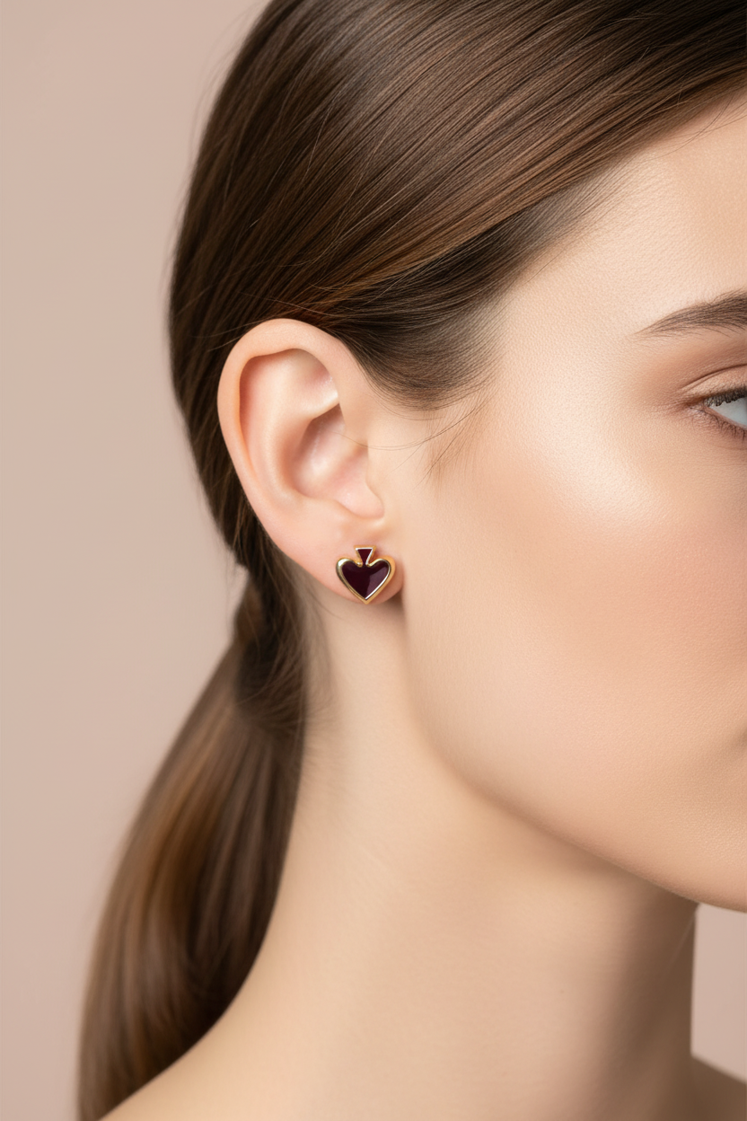 Kate Spade Heritage Spade Small Heart Stud Earrings worn on ear editorial