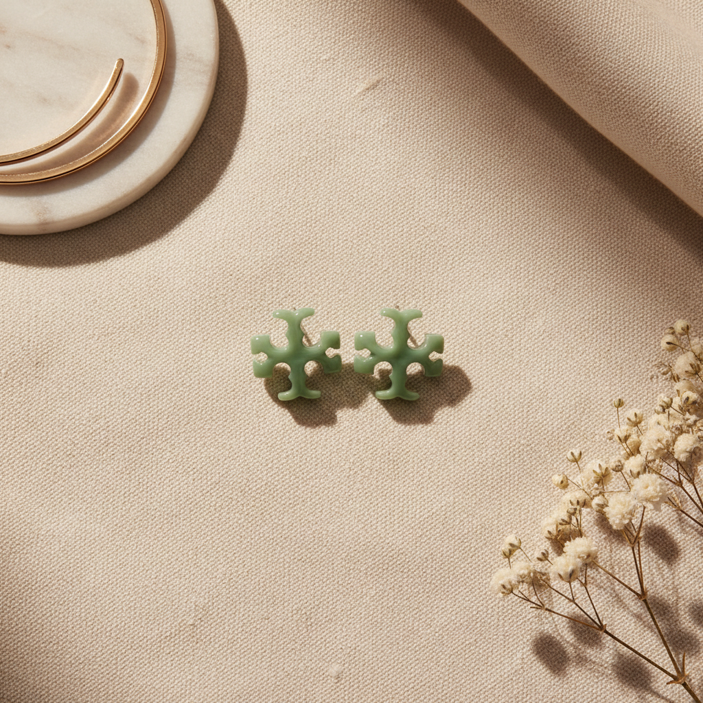 Tory Burch Roxanne Cross Stud Earrings Azure Green - Cream Linen Flat Lay
