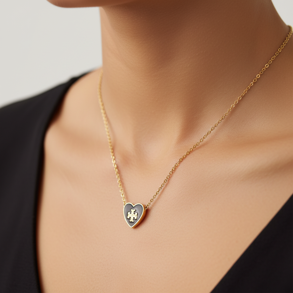 Tory Burch Kira black enamel heart necklace collarbone close-up