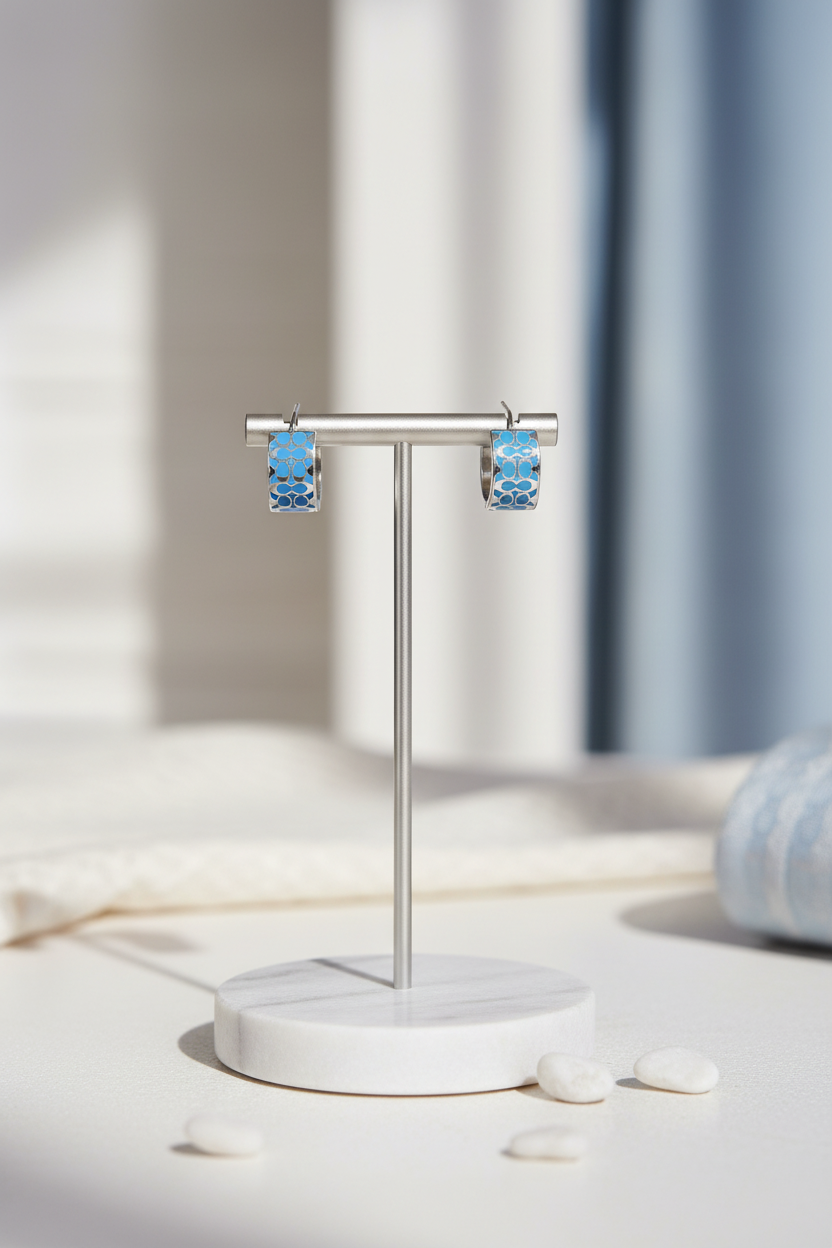 Coach Signature Enamel Huggie Earrings jewelry stand lifestyle