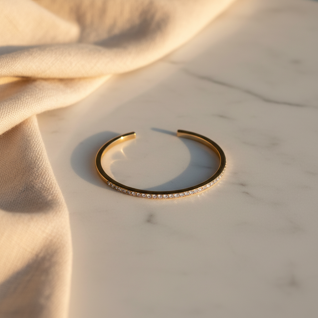 Kate Spade Gold Cuff Bracelet with Cubic Zirconia – marble flat lay