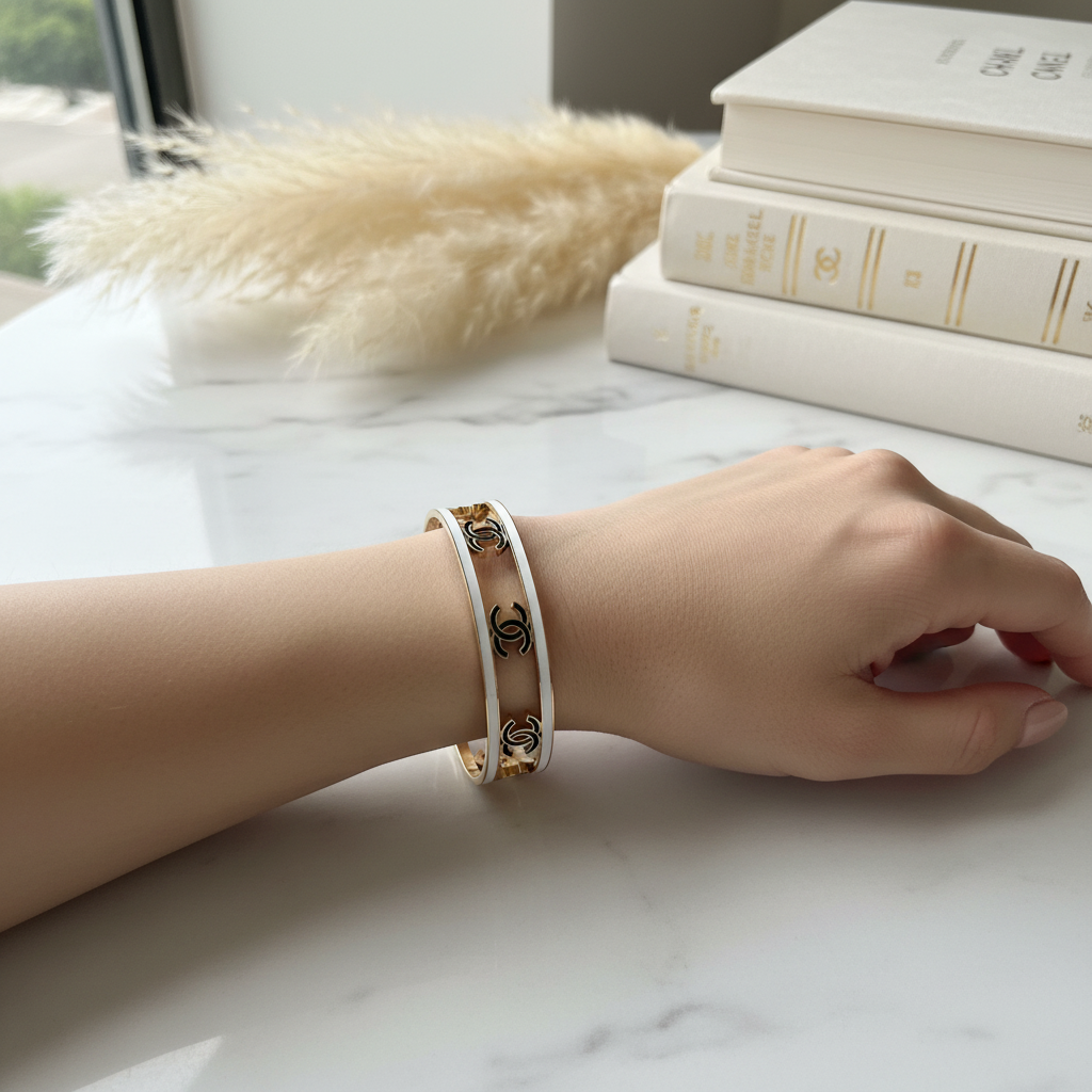 Chanel CC Logo Cuff Bracelet worn on wrist – lifestyle editorial