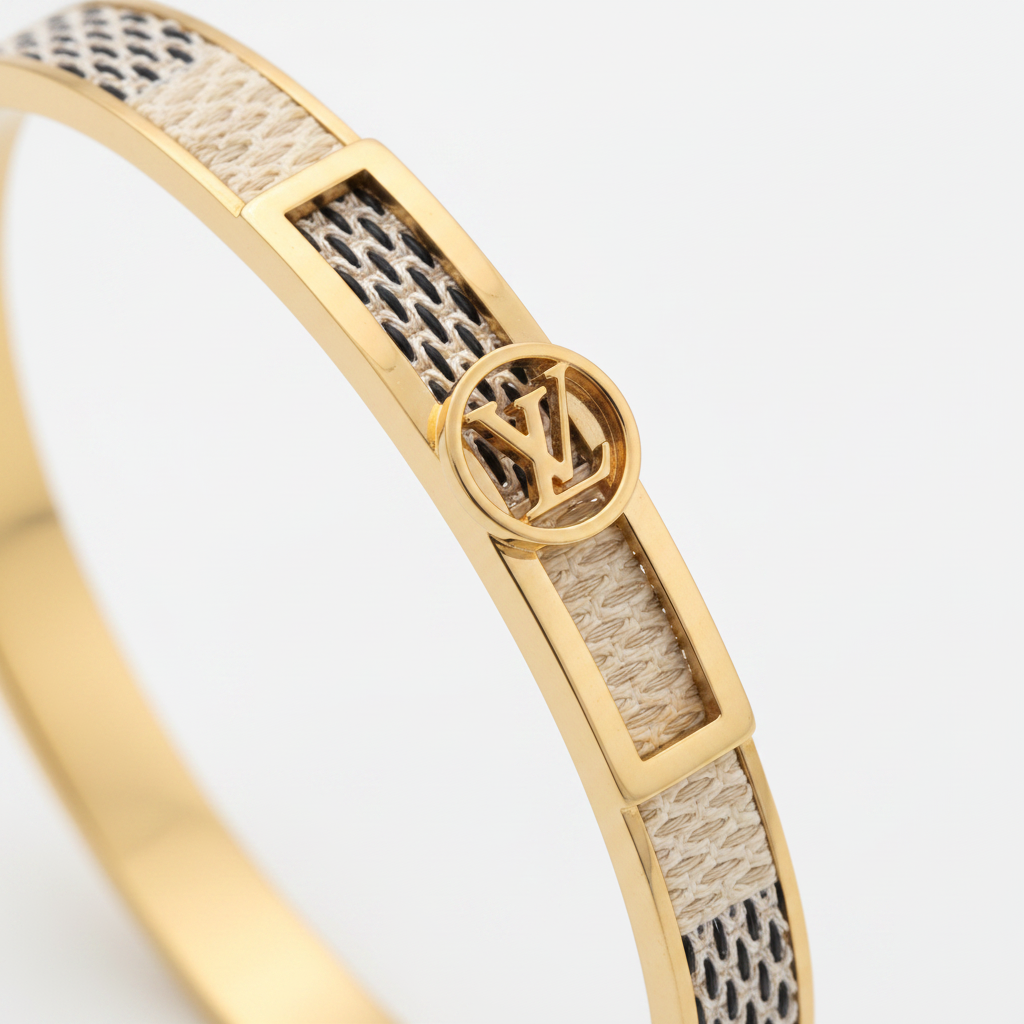 Close-up macro of LV Damier Azur gold woven mesh pattern and logo clasp
