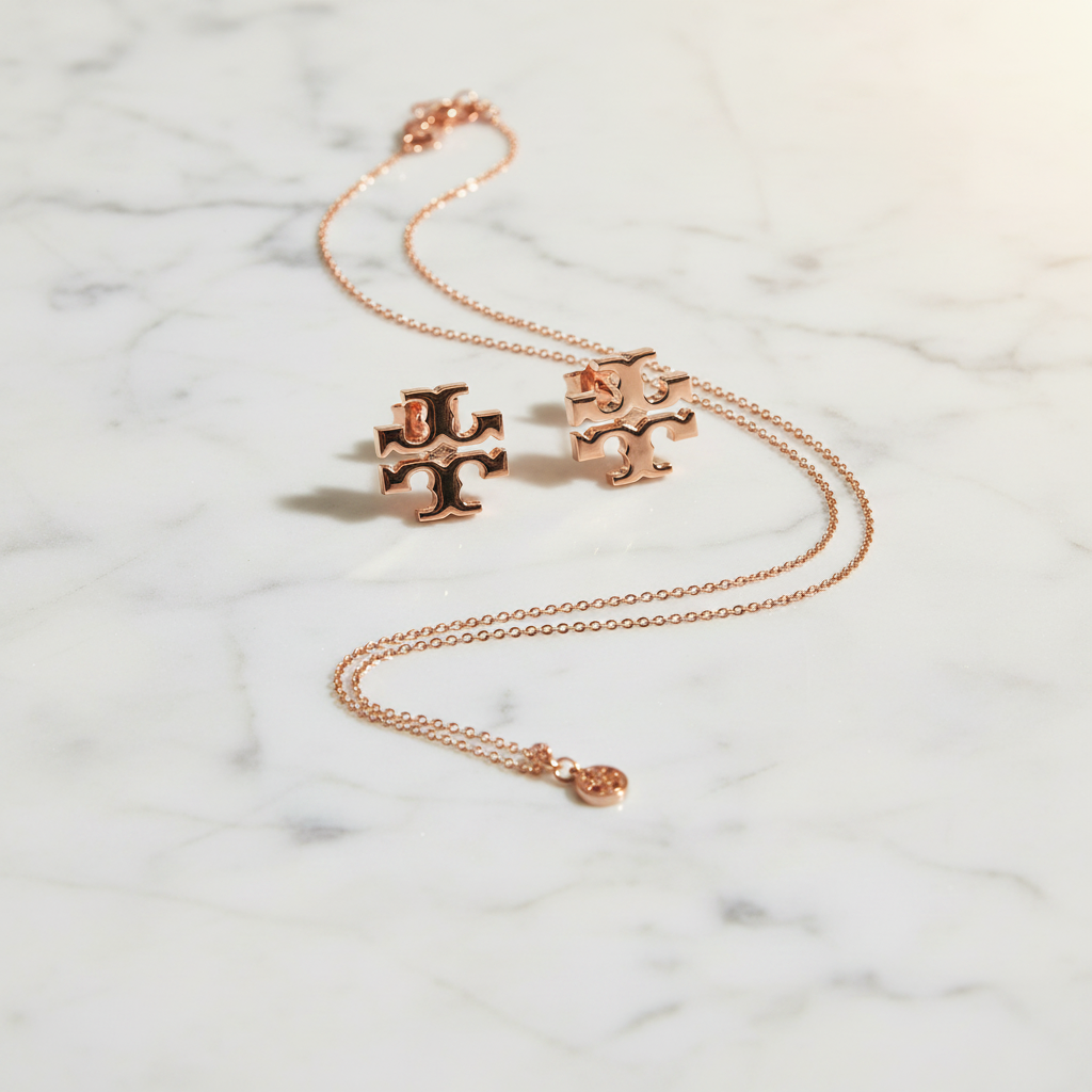 Tory Burch Icon Monogram Stud Earrings in Rose Gold styled flat lay