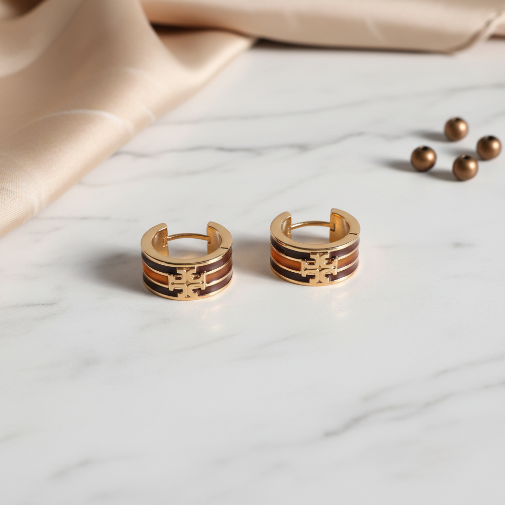 Tory Burch Icon Huggie Earrings - Marble Flat Lay