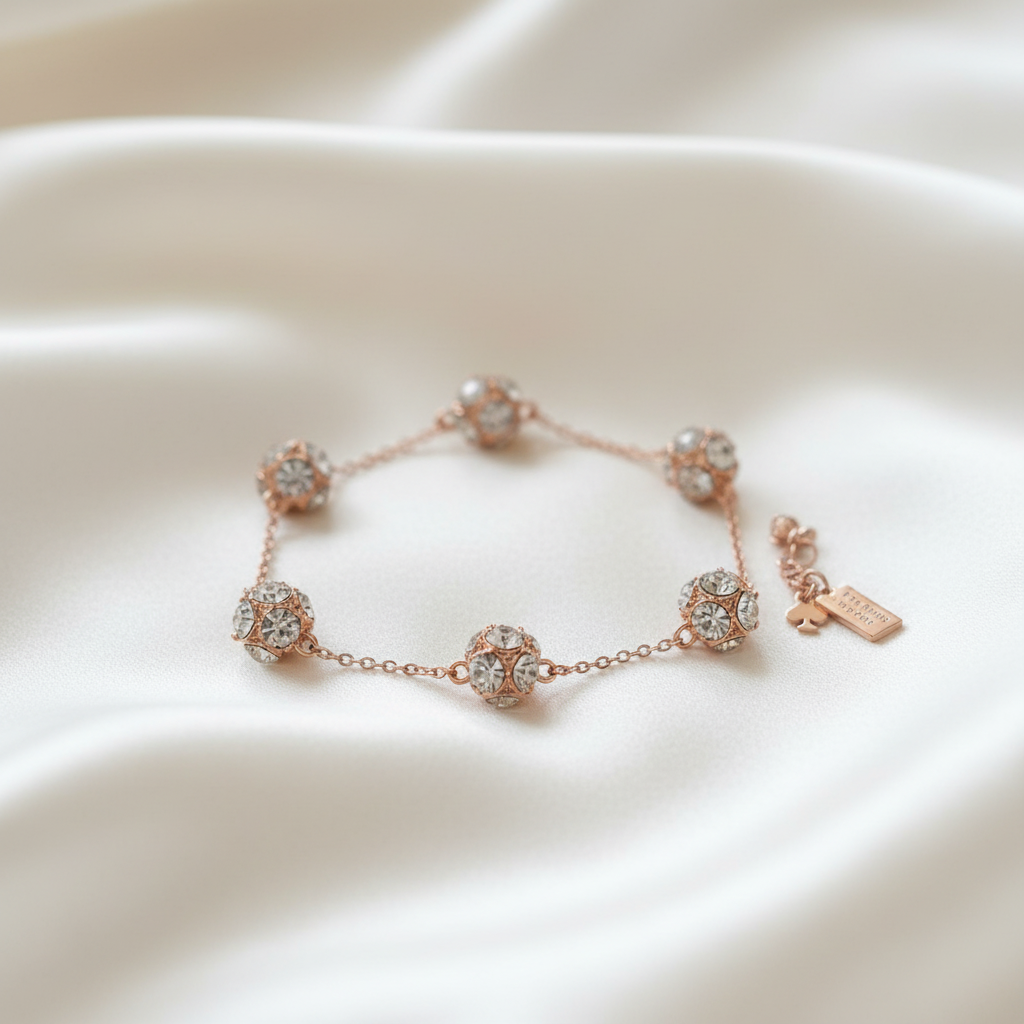 Kate Spade Lady Marmalade Rose Gold Bracelet ivory silk flat lay