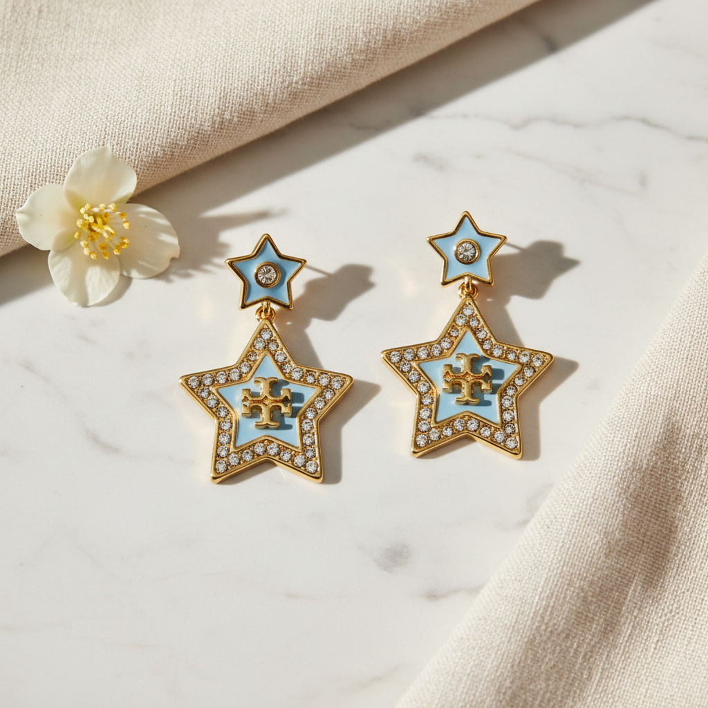 Tory Burch Kira Falling Star Drop Earrings marble flat lay