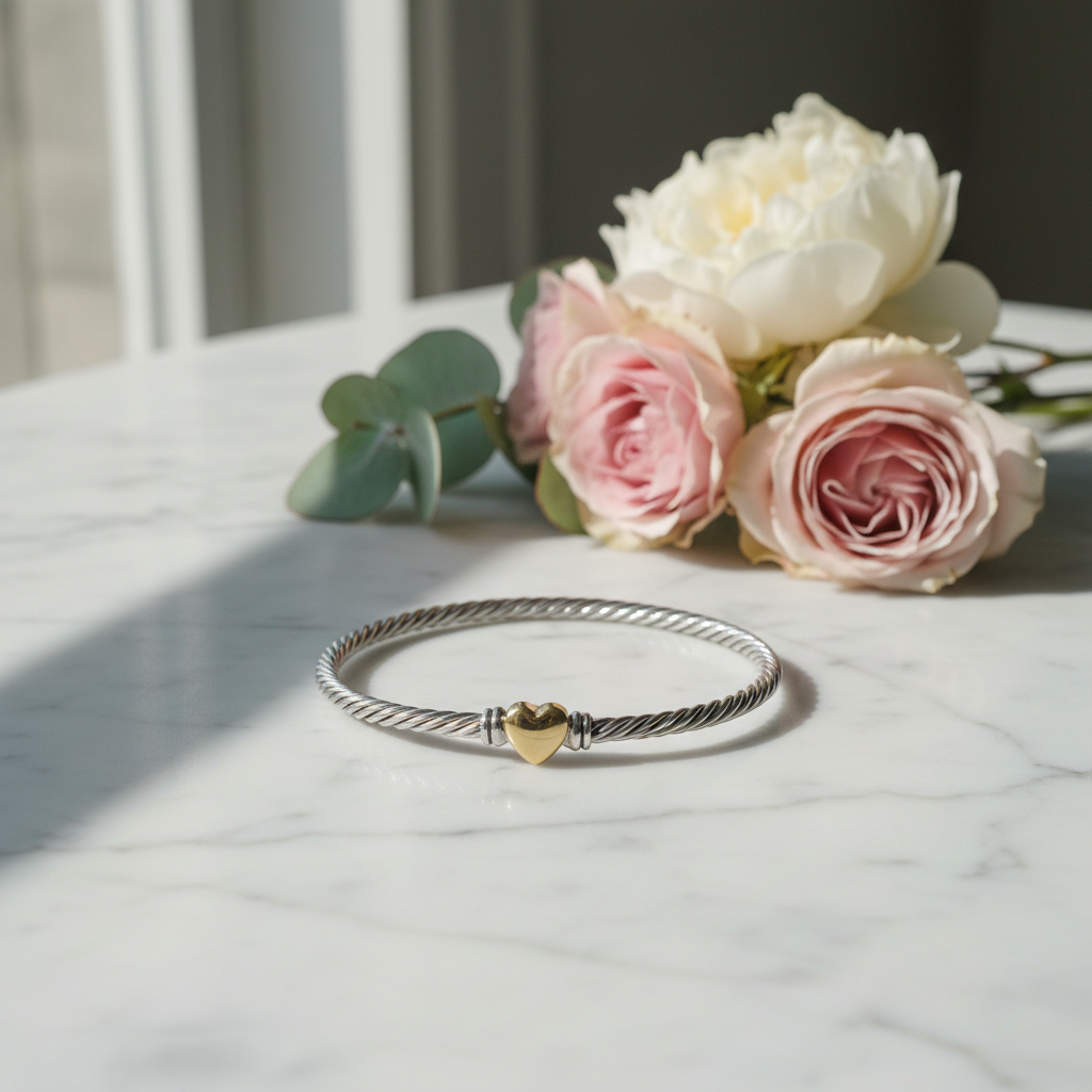 David Yurman Classic Cable Heart Station Bracelet on marble surface with florals