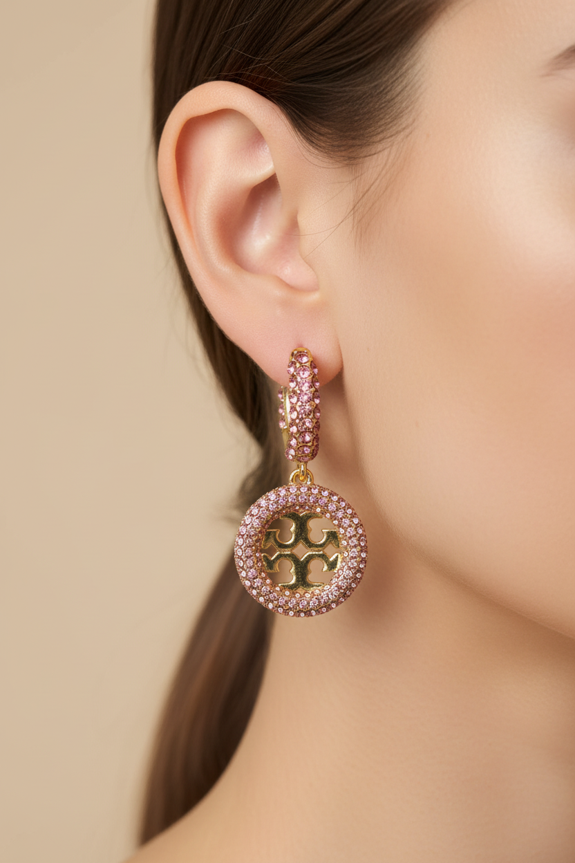 Tory Burch Miller Pavé Hoop Earrings in Gold/Pink Crystal - worn on model's ear