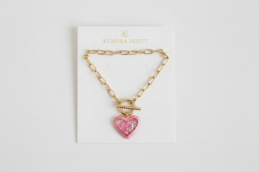 Kendra Scott logo at top, glitter heart on packaging